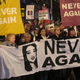Abortion rights protestors marching with images of Savita Halappanavar in Dublin in 2012. Photo via AP Images.